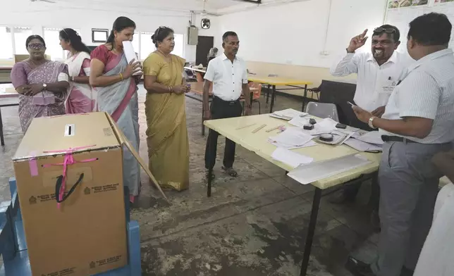 Polling officers set up their booth in Colombo, Sri Lanka, Saturday, Sept. 21, 2024. (AP Photo/Rajesh Kumar Singh)