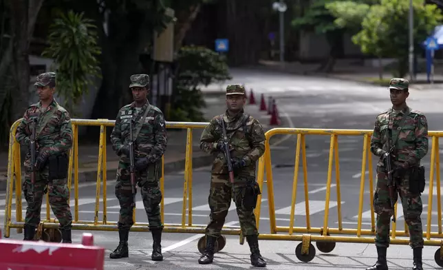 Police commandos stand guard outside a ballot counting center during presidential election in Colombo, Sri Lanka, Sunday, Sept. 22, 2024(AP Photo/Rajesh Kumar Singh)