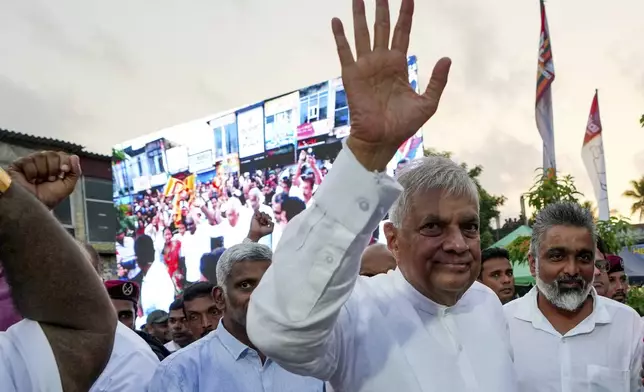 FILE - Sri Lankan President Ranil Wickremesinghe waves to supporters as he arrives to address a public election rally in Minuwangoda, Sri Lanka, Tuesday, Sept. 17, 2024. (AP Photo/Rajesh Kumar Singh, File)