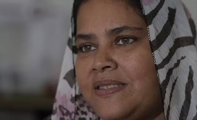 Fathima Shiyama, 48, who sells food on a mobile cart to support her five children, speaks to the Associated Press at her residence in Colombo, Sri Lanka, Tuesday, Sept. 3, 2024. (AP Photo/Eranga Jayawardena)