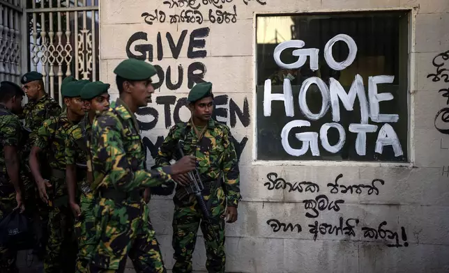 FILE - Sri Lanka army soldiers patrol near the official residence of president Gotabaya Rajapaksa three days after it was stormed by anti government protesters in Colombo in Colombo, Sri Lanka, on July 12, 2022. (AP Photo/Rafiq Maqbool, File)