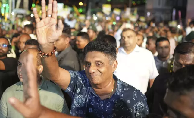 Presidential candidate and opposition leader Sajith Premadasa of the Samagi Jana Balawgaya or United People's Power party waves to supporters as he arrives for the final election rally in Colombo, Sri Lanka, Wednesday, Sept. 18, 2024. (AP Photo/Rajesh Kumar Singh)