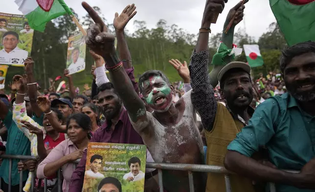 Tea plantation workers cheer for their political leaders during a presidential election rally in Thalawakele, Sri Lanka, Sunday, Sept. 8, 2024. (AP Photo/Eranga Jayawardena)