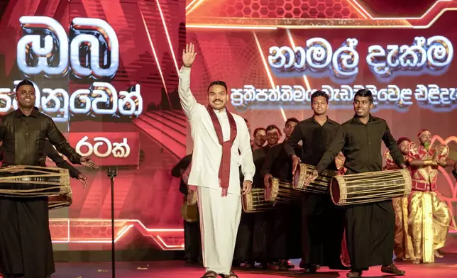 FILE - Presidential candidate Namal Rajapaksa, elder son of former president Mahinda Rajapaksa waves during the launching of his election manifesto in Colombo, Sri Lanka, Monday, Sept. 2, 2024. (AP Photo/Eranga Jayawardena, File)