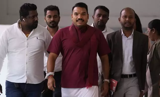 FILE - Presidential candidate Namal Rajapaksa arrives for a meeting along with his supporters in Colombo, Sri Lanka, Thursday, Sept. 5, 2024. (AP Photo/Eranga Jayawardena, File)