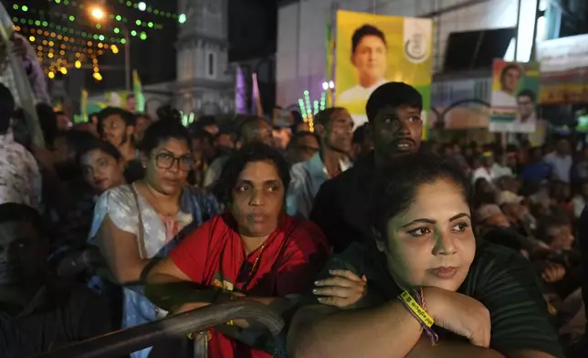 Women listen to Sajith Premadasa, unseen, the presidential candidate and opposition leader of the Samagi Jana Balawgaya or United People's Power party during an election rally, in Colombo, Sri Lanka, Wednesday, Sept. 18, 2024. (AP Photo/Rajesh Kumar Singh)