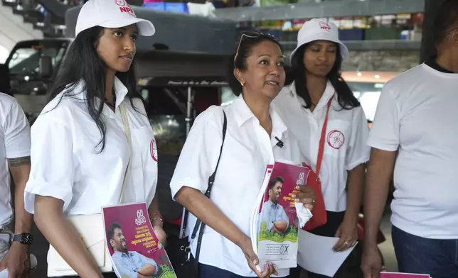 Sri Lankan women, who live outside of Sri Lanka, campaign for the National People's Power presidential candidate Anura Dissanayaka, in Colombo, Sri Lanka, Wednesday, Sept. 18, 2024. (AP Photo/Rajesh Kumar Singh)