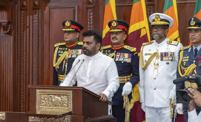 Commanders of the security forces stand behind as Sri Lanka's new president Anura Kumara Dissanayake, addresses a gathering after he was sworn in at the Sri Lankan President's Office in Colombo, Sri Lanka, Monday, Sept.23, 2024. (Sri Lankan President's Office via AP)