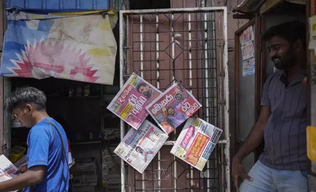 Newspapers with headlines about Sri Lanka's new president elect Marxist lawmaker Anura Kumara Dissanayake are on display in Colombo, Sri Lanka, Monday, Sept. 23, 2024. (AP Photo/Eranga Jayawardena)