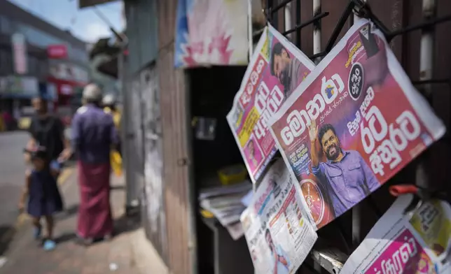 Newspapers with headlines about the new president elect Marxist lawmaker Anura Kumara Dissanayake are on display in Colombo, Sri Lanka, Monday, Sept. 23, 2024. (AP Photo/Eranga Jayawardena)