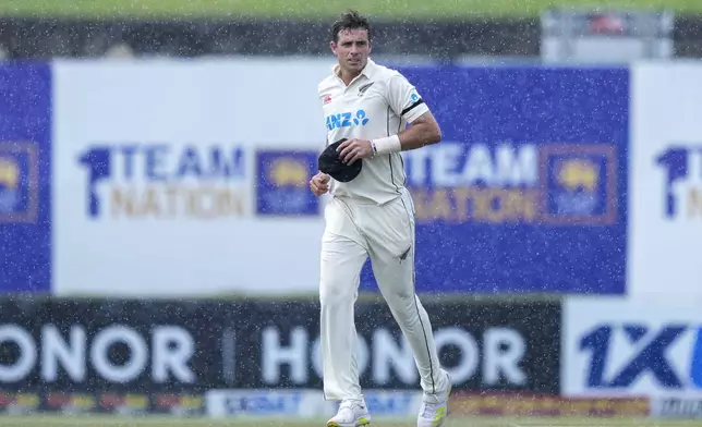 New Zealand's captain Tim Southee runs off the field as it rains during the day one of the first test cricket match between Sri Lanka and New Zealand in Galle , Sri Lanka, Thursday, Sept. 26, 2024. (AP Photo/Eranga Jayawardena)