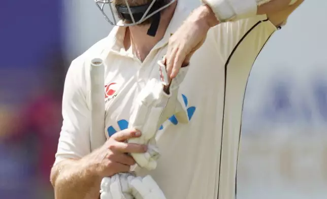 New Zealand's Kane Williamson leaves the field after losing his wicket during the day three of the second test cricket match between Sri Lanka and New Zealand in Galle , Sri Lanka, Saturday, Sept. 28, 2024. (AP Photo/Eranga Jayawardena)