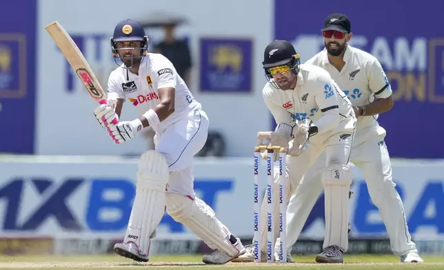 Sri Lanka's Dinesh Chandimal plays a shot during the day one of the first test cricket match between Sri Lanka and New Zealand in Galle, Sri Lanka, Thursday, Sept. 26, 2024. (AP Photo/Eranga Jayawardena)