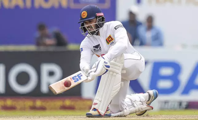 Sri Lanka's captain Dhananjaya de Silva plays a shot during the day two of the first test cricket match between Sri Lanka and New Zealand in Galle, Sri Lanka, Friday, Sept. 27, 2024. (AP Photo/Eranga Jayawardena)