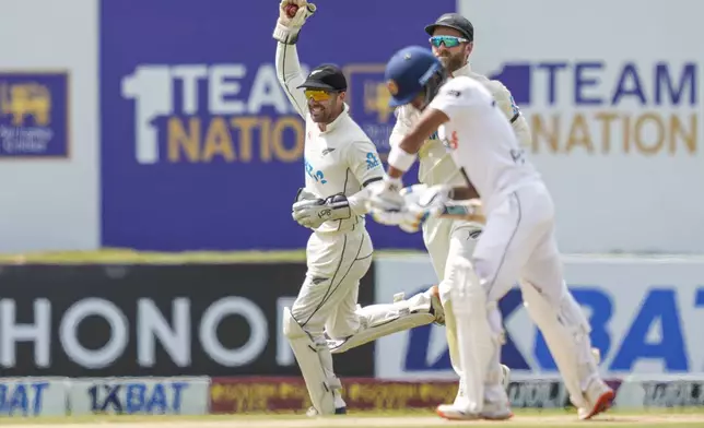 New Zealand's wicketkeeper Tom Blundell celebrates taking catch to dismiss Sri Lanka's Pathum Nissanka during the day one of the first test cricket match between Sri Lanka and New Zealand in Galle , Sri Lanka, Thursday, Sept. 26, 2024. (AP Photo/Eranga Jayawardena)