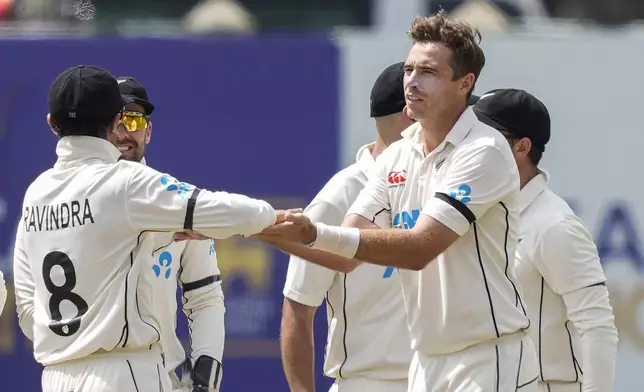 New Zealand's captain Tim Southee celebrates the wicket of Sri Lanka's Pathum Nissanka with his team mates during the day one of the first test cricket match between Sri Lanka and New Zealand in Galle , Sri Lanka, Thursday, Sept. 26, 2024. (AP Photo/Eranga Jayawardena)