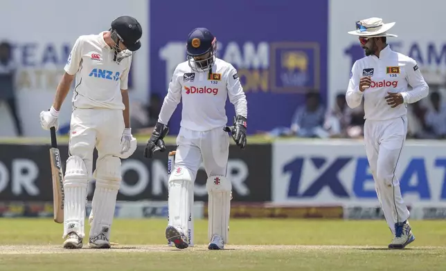 New Zealand's Mitchell Santner leaves the field after losing his wicket during the day three of the second test cricket match between Sri Lanka and New Zealand in Galle , Sri Lanka, Saturday, Sept. 28, 2024. (AP Photo/Eranga Jayawardena)