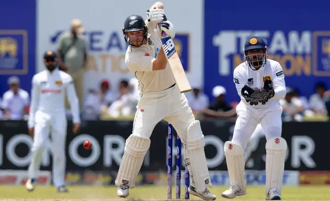 New Zealand's Glenn Phillips plays a shot on the third day of the first cricket test match between New Zealand and Sri Lanka in Galle, Sri Lanka, Friday, Sept. 20, 2024. (AP Photo/Viraj Kothalawala)