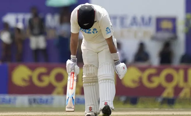 New Zealand's Daryl Mitchell reacts after losing his wicket during the day three of the second test cricket match between Sri Lanka and New Zealand in Galle , Sri Lanka, Saturday, Sept. 28, 2024. (AP Photo/Eranga Jayawardena)