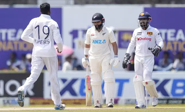 Sri Lanka's Nishan Peiris celebrates the wicket of New Zealand's Ajaz Patel during the day three of the second test cricket match between Sri Lanka and New Zealand in Galle , Sri Lanka, Saturday, Sept. 28, 2024. (AP Photo/Eranga Jayawardena)