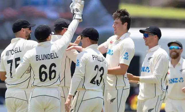 New Zealand's William O'Rourke, third right, celebrates with teammates the wicket of Sri Lanka's Pathum Nissanka on the third day of the first cricket test match between New Zealand and Sri Lanka in Galle, Sri Lanka, Friday, Sept. 20, 2024. (AP Photo/Viraj Kothalawala)