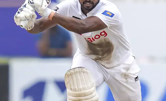 Sri Lanka's Kamindu Mendis plays a shot during the day two of the first test cricket match between Sri Lanka and New Zealand in Galle, Sri Lanka, Friday, Sept. 27, 2024. (AP Photo/Eranga Jayawardena)