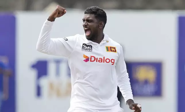 Sri Lanka's Nishan Peiris celebrates the wicket of New Zealand's Tom Blundell during the day four of the second test cricket match between Sri Lanka and New Zealand in Galle, Sri Lanka, Sunday, Sept. 29, 2024. (AP Photo/Eranga Jayawardena)