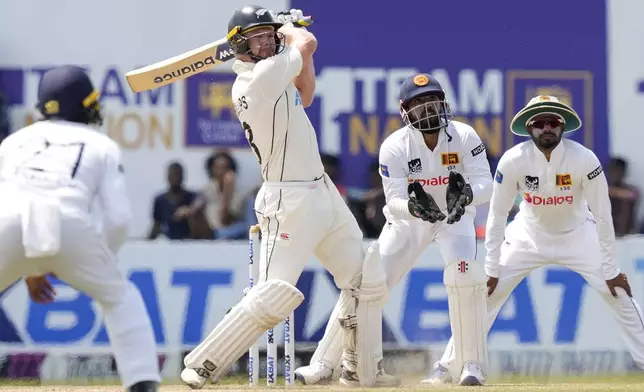 New Zealand's Glenn Phillips plays a shot during the day four of the second test cricket match between Sri Lanka and New Zealand in Galle, Sri Lanka, Sunday, Sept. 29, 2024. (AP Photo/Eranga Jayawardena)