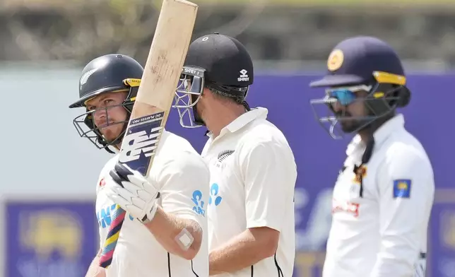 New Zealand's Glenn Phillips celebrates his fifty runs during the day four of the second test cricket match between Sri Lanka and New Zealand in Galle, Sri Lanka, Sunday, Sept. 29, 2024. (AP Photo/Eranga Jayawardena)