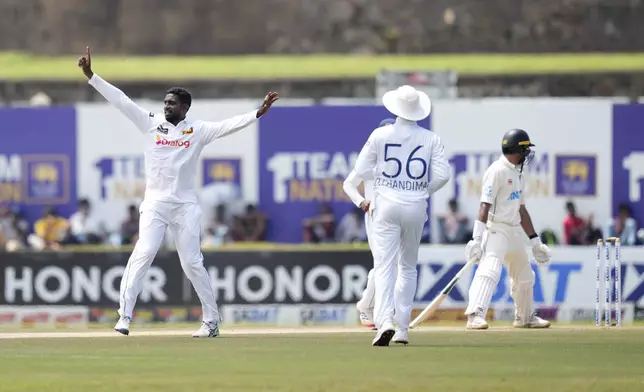 Sri Lanka's Nishan Peiris celebrates the wicket of New Zealand's Rachin Ravindra during the day three of the second test cricket match between Sri Lanka and New Zealand in Galle , Sri Lanka, Saturday, Sept. 28, 2024. (AP Photo/Eranga Jayawardena)