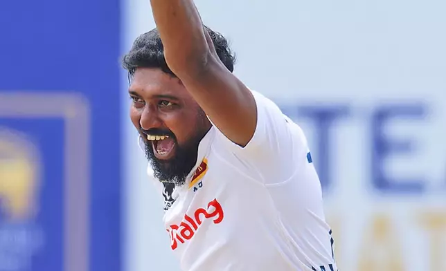 Sri Lanka's Prabath Jayasuriya celebrates the wicket of New Zealand's Rachin Ravindra on the fifth and final day of the first cricket test match between New Zealand and Sri Lanka in Galle, Sri Lanka, Monday, Sept. 23, 2024. (AP Photo/Viraj Kothalawala)