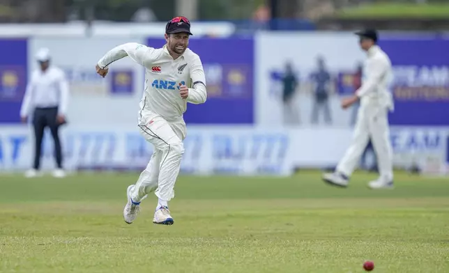 New Zealand's Devon Conway runs to field a ball during the day one of the first test cricket match between Sri Lanka and New Zealand in Galle , Sri Lanka, Thursday, Sept. 26, 2024. (AP Photo/Eranga Jayawardena)