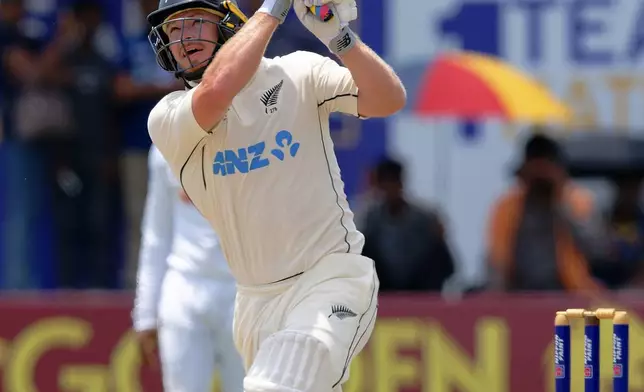 New Zealand's Glenn Phillips plays a shot on the third day of the first cricket test match between New Zealand and Sri Lanka in Galle, Sri Lanka, Friday, Sept. 20, 2024. (AP Photo/Viraj Kothalawala)