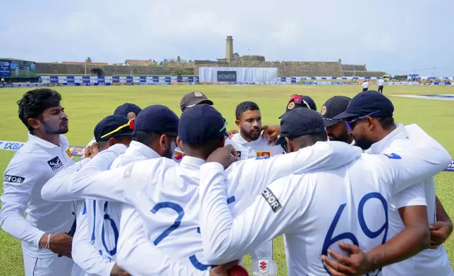 Sri Lanka's players form a huddle before the start of the game on the fifth and final day of the first cricket test match between New Zealand and Sri Lanka in Galle, Sri Lanka, Monday, Sept. 23, 2024. (AP Photo/Viraj Kothalawala)