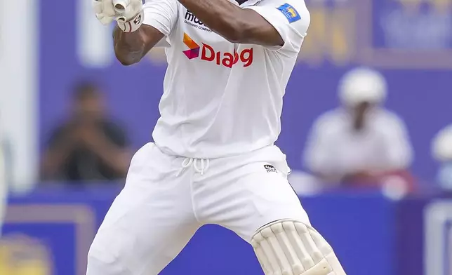 Sri Lanka's Kamindu Mendis plays a shot during the day two of the first test cricket match between Sri Lanka and New Zealand in Galle, Sri Lanka, Friday, Sept. 27, 2024. (AP Photo/Eranga Jayawardena)