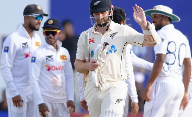 New Zealand's Kane Williamson, foreground, reacts as he leaves the field after losing his wicket on the second day of the first cricket test match between New Zealand and Sri Lanka in Galle, Sri Lanka, Thursday, Sept. 19, 2024. (AP Photo/Viraj Kothalawala)