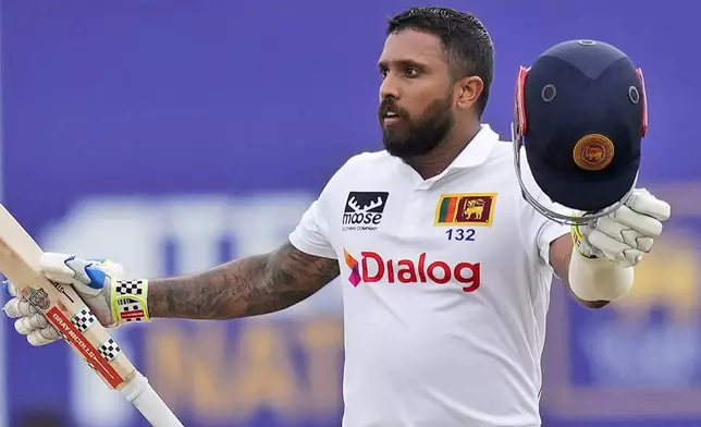 Sri Lanka's Kusal Mendis celebrates his century during the day two of the first test cricket match between Sri Lanka and New Zealand in Galle, Sri Lanka, Friday, Sept. 27, 2024. (AP Photo/Eranga Jayawardena)