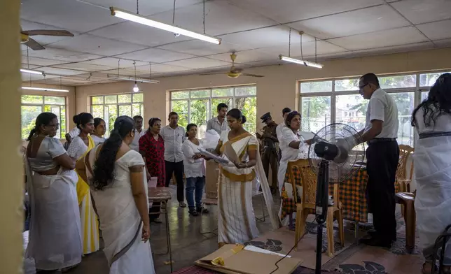 Election officers seal the documents and ballot box at the end of voting during presidential election in Colombo, Sri Lanka, Saturday, Sept. 21, 2024. (AP Photo/Rajesh Kumar Singh)