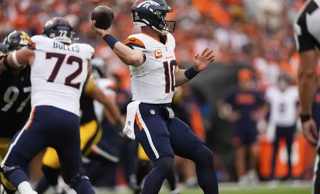 Denver Broncos quarterback Bo Nix (10) throws during the second half of an NFL football game against the Pittsburgh Steelers, Sunday, Sept. 15, 2024, in Denver. (AP Photo/David Zalubowski)