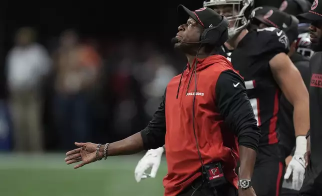 Atlanta Falcons head coach Raheem Morris looks up during the first half of an NFL football game against the Pittsburgh Steelers on Sunday, Sept. 8, 2024, in Atlanta. (AP Photo/John Bazemore)