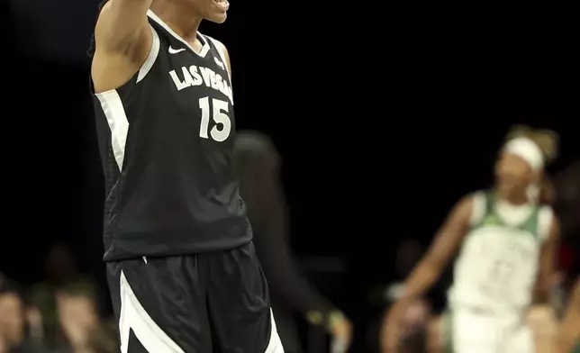 Las Vegas Aces guard Tiffany Hayes (15) reacts to a play during a first-round WNBA basketball playoff game against the Seattle Storm, Sunday, Sept. 22, 2024, in Las Vegas. (AP Photo/Ronda Churchill)