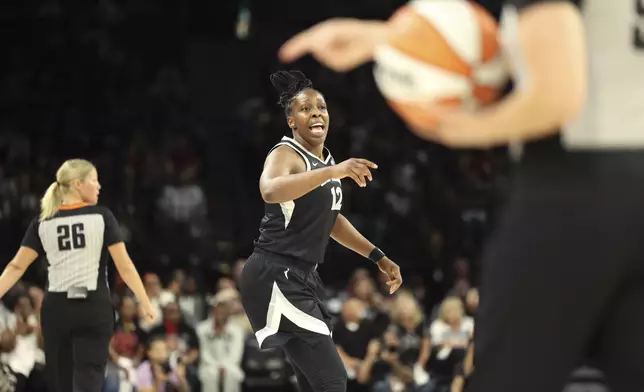 Las Vegas Aces guard Chelsea Gray (12) reacts to a call during a first-round WNBA basketball playoff game against the Seattle Storm, Sunday, Sept. 22, 2024, in Las Vegas. (AP Photo/Ronda Churchill)