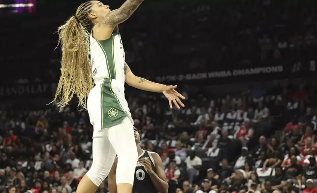 Seattle Storm forward Gabby Williams (5) lays up the ball during a first-round WNBA basketball playoff game against the Las Vegas Aces, Sunday, Sept. 22, 2024, in Las Vegas. (AP Photo/Ronda Churchill)