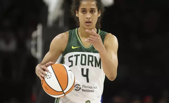 Seattle Storm guard Skylar Diggins-Smith (4) signals while taking the ball down court during a first-round WNBA basketball playoff game against the Las Vegas Aces, Sunday, Sept. 22, 2024, in Las Vegas. (AP Photo/Ronda Churchill)