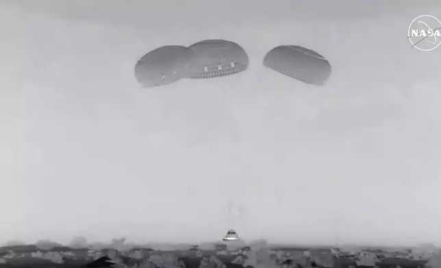 In this image from video provided by NASA, the empty Boeing Starliner capsule touches down at White Sands Missile Range in New Mexico late Friday, Sept. 6, 2024, after undocking from the International Space Station. (NASA via AP)