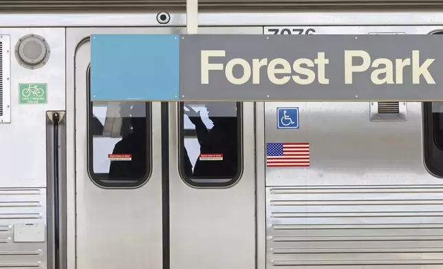 Police investigators work inside a CTA Blue Line train parked at the Forest Park station after a shooting, Monday, Sept. 2, 2024, in Forest Park, Ill. (John J. Kim/Chicago Tribune via AP)