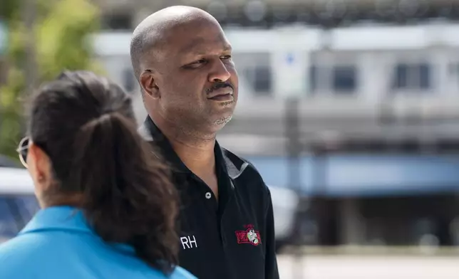 Forest Park Mayor Rory Hoskins stands outside the Forest Park Blue Line train station in Forest Park, Ill., which remains closed, after giving a news conference about four people who were fatally shot on the train early Monday, Sept. 2, 2024. (Pat Nabong/Chicago Sun-Times via AP)