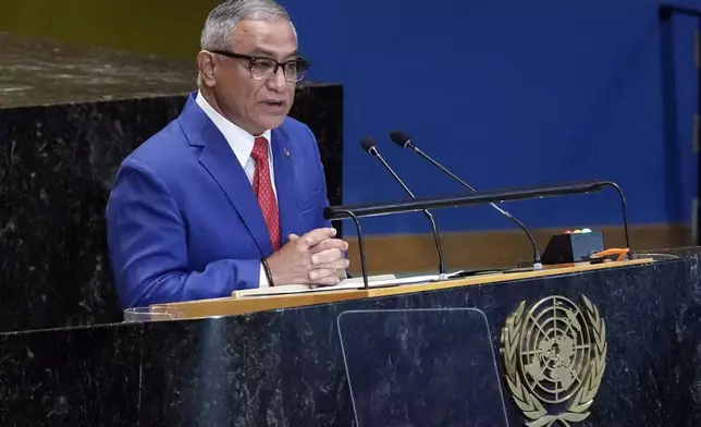 Prime Minister of Belize John Briceno addresses the the Summit of the Future, in the United Nations General Assembly, Monday, Sept. 23, 2024. (AP Photo/Richard Drew)