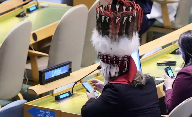 A member of the Canadian delegation attends the Summit of the Future, in the United Nations General Assembly, Monday, Sept. 23, 2024. (AP Photo/Richard Drew)