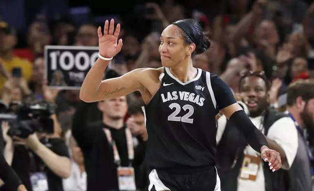 Las Vegas Aces center A'ja Wilson (22) celebrates during the second half of an WNBA basketball game against the Connecticut Sun Sunday, Sept. 15, 2024, in Las Vegas.(Steve Marcus/Las Vegas Sun via AP)